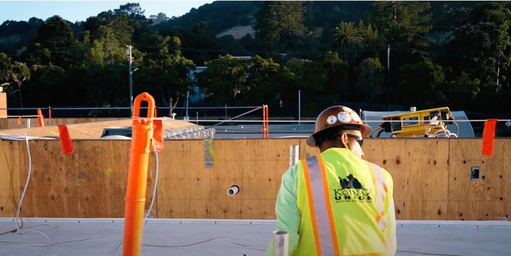 Kodiak worker on a commercial roof