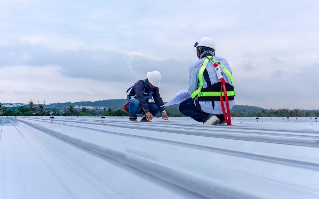 Workers Ontop Of Warehouse Roof